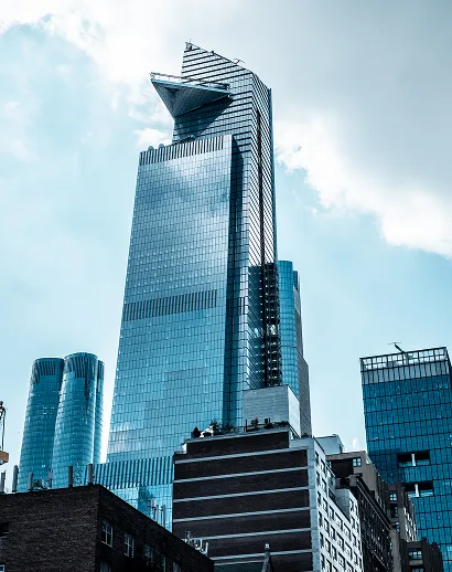 vertical low angle shot modern glass business buildings touching sky 1